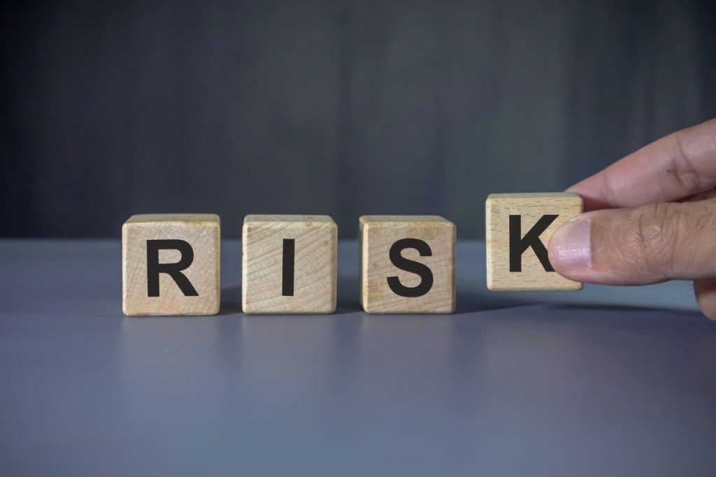 wooden block with risk word
